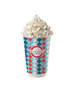 Hot Sugar Cookie Latte in blue Scooter's Coffee cup with whipped cream topped with red and green sprinkles
