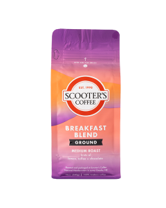 Purple and orange coffee bag with text that says Scooter's Coffee Breakfast Blend